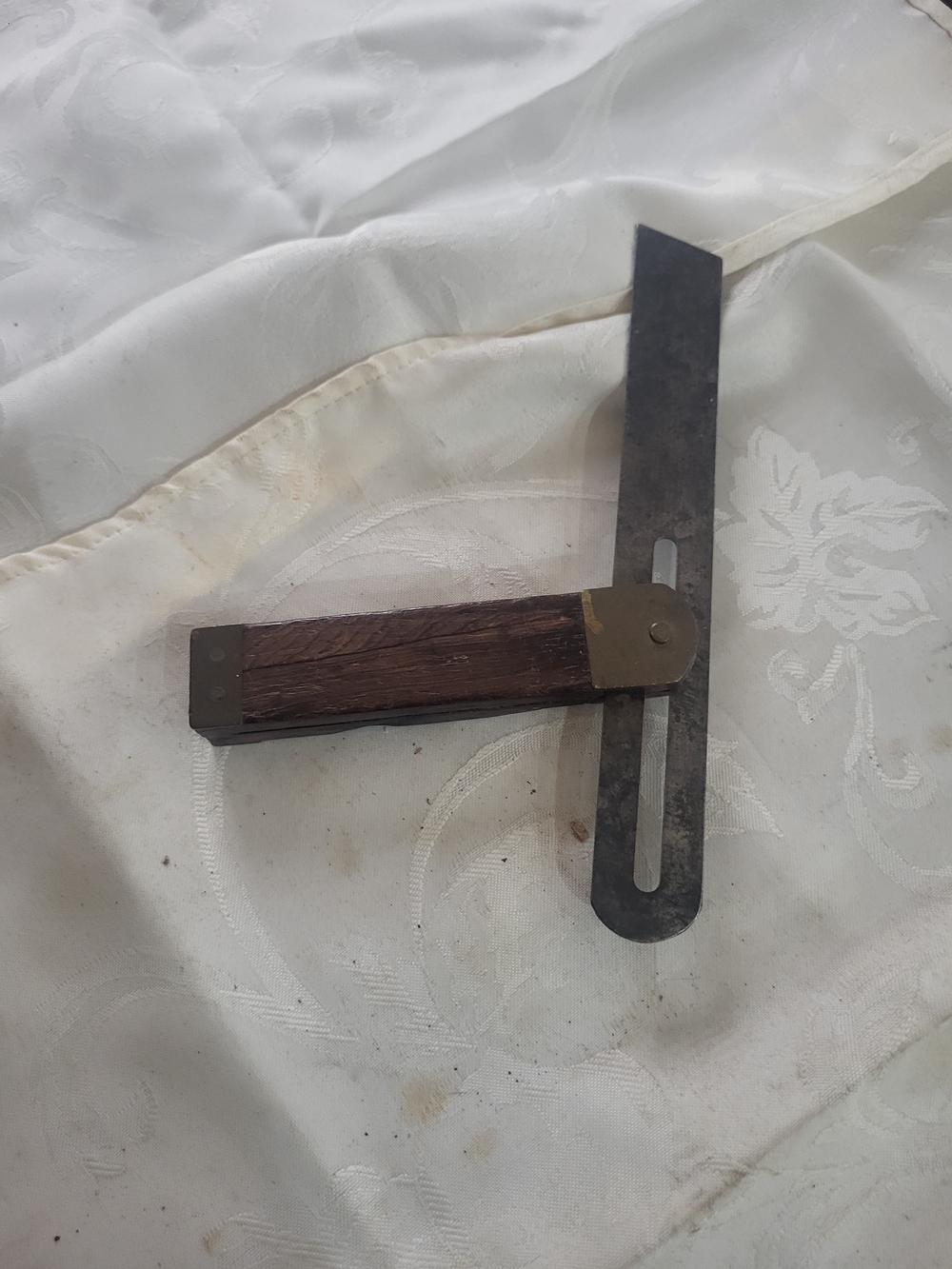 This is a vintage stanley sliding T Bevel with adjustment screw and wood handle.
